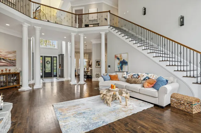 a kitchen with stainless steel appliances granite countertop a refrigerator a stove a sink and a microwave