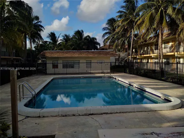 a view of swimming pool with a yard