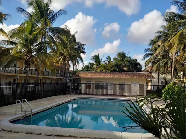 a view of swimming pool with chairs