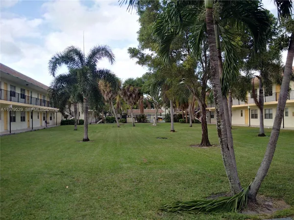a view of a park with swings and slides