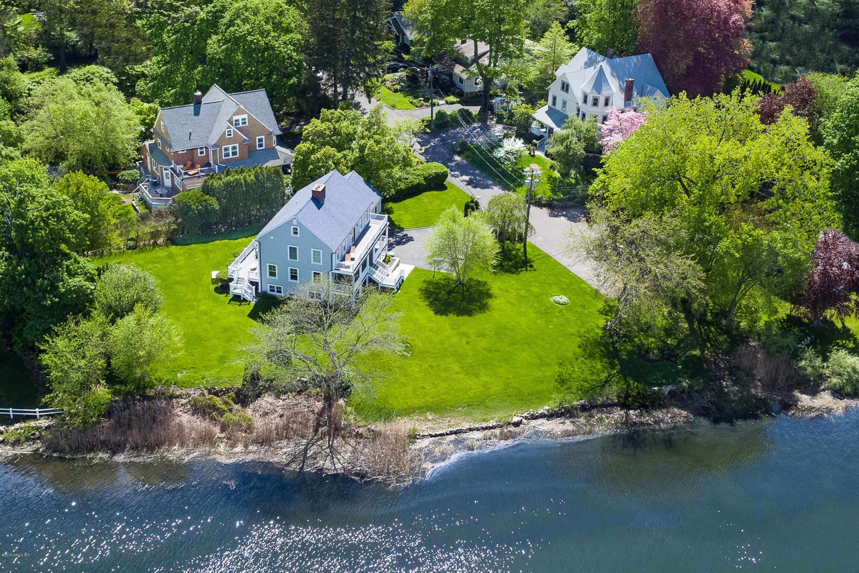 35 Chapel Lane Riverside, CT 06878 - Photo 1 of 45 an aerial view of a house with a garden and pool