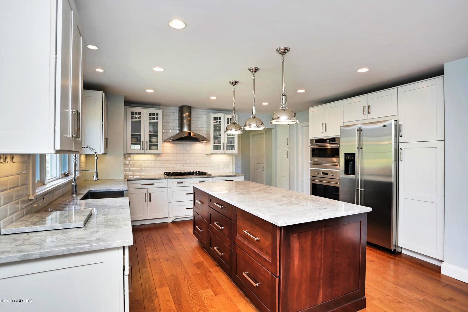 35 Chapel Lane Riverside, CT 06878 - Photo 14 of 45 a kitchen with stainless steel appliances granite countertop a refrigerator a sink and a stove