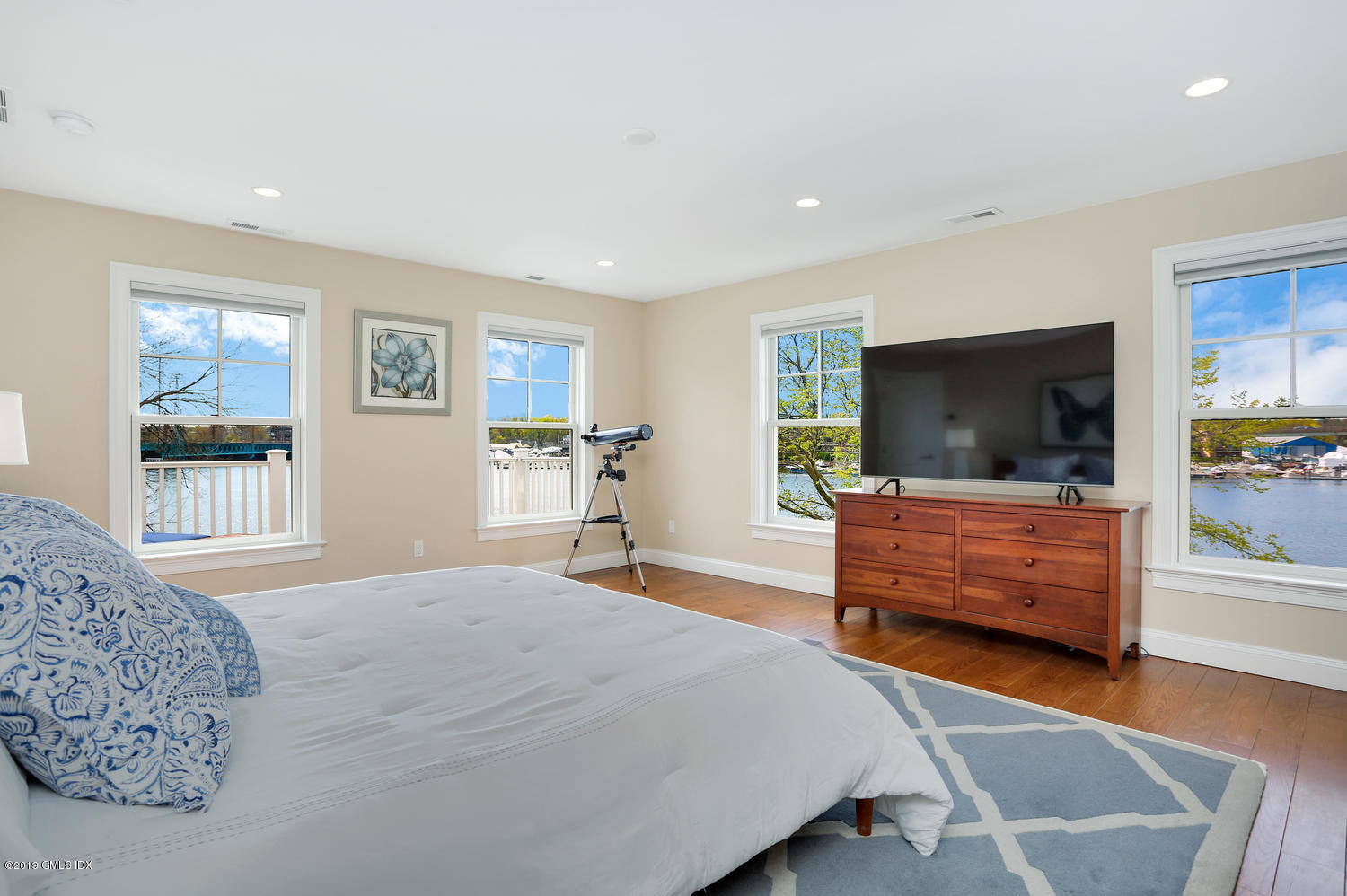 35 Chapel Lane Riverside, CT 06878 - Photo 22 of 45 a bedroom with furniture and a flat screen tv