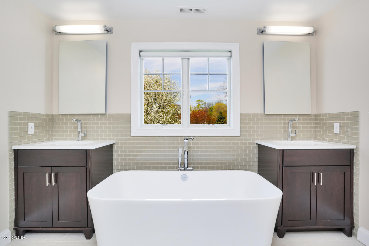 35 Chapel Lane Riverside, CT 06878 - Photo 25 of 45 a white bath tub sitting in a bathroom
