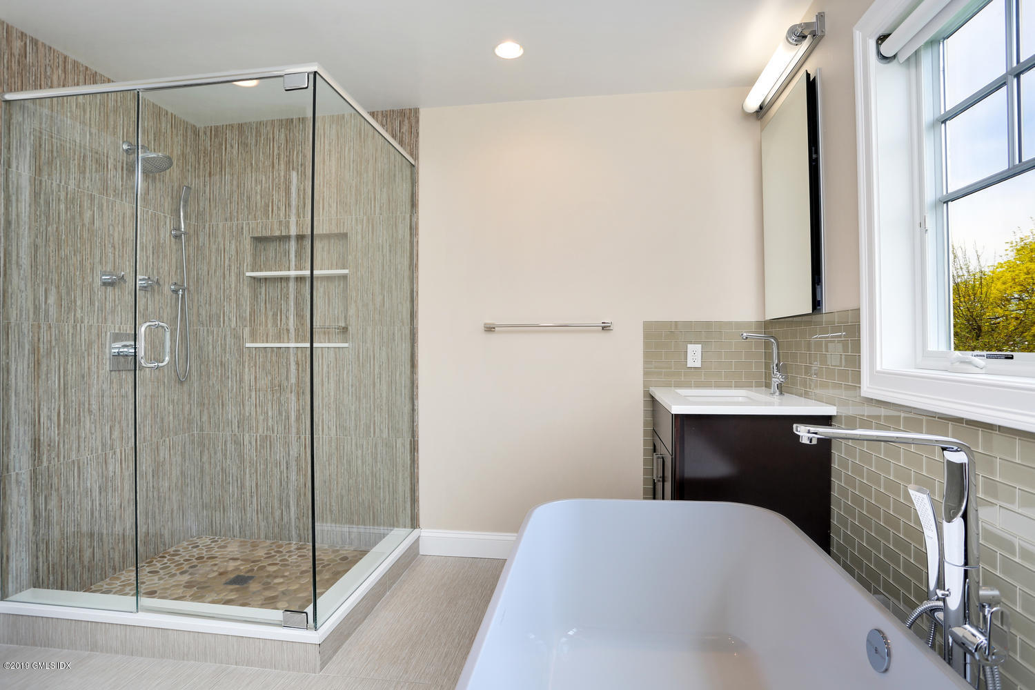 35 Chapel Lane Riverside, CT 06878 - Photo 26 of 45 a en suite bathroom with a shower sink and mirror