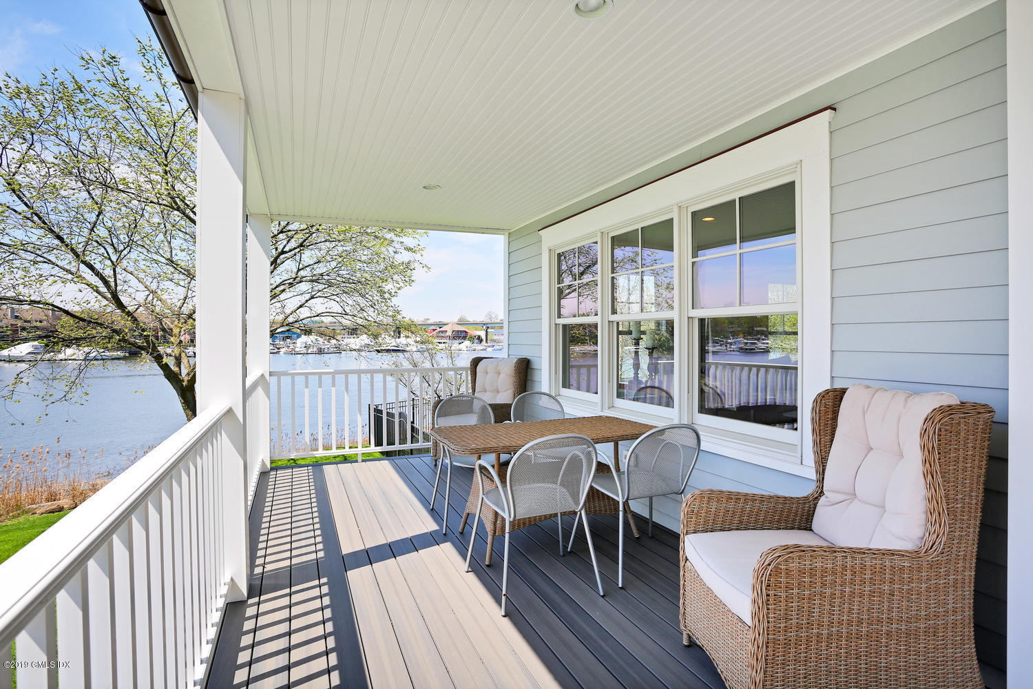 35 Chapel Lane Riverside, CT 06878 - Photo 3 of 45 a balcony with furniture and wooden floor
