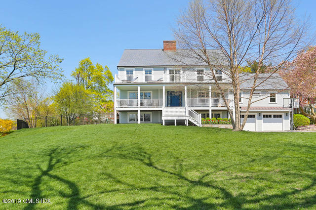 35 Chapel Lane Riverside, CT 06878 - Photo 4 of 45 a front view of a building with a garden