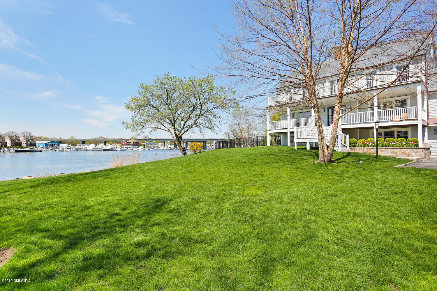 35 Chapel Lane Riverside, CT 06878 - Photo 6 of 45 a view of a house with a big yard and large trees