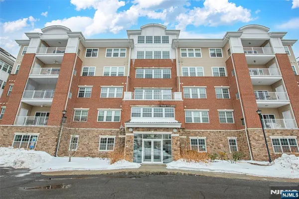 a front view of multi story residential apartment building