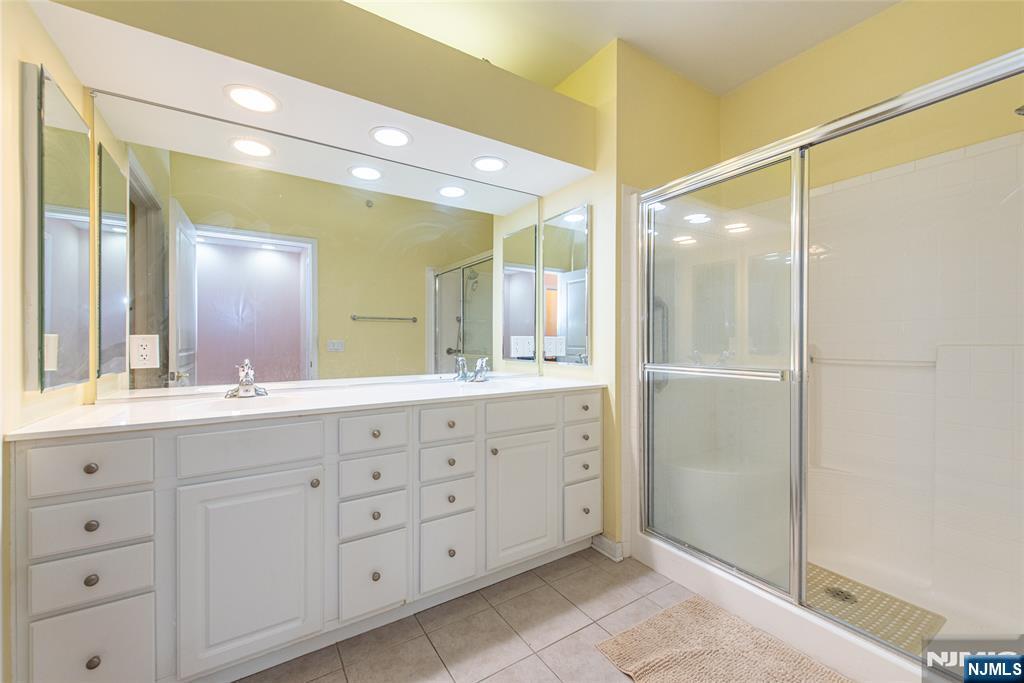 10323 Warrens Way Wanaque, NJ 07465 - Photo 16 of 30 a bathroom with a granite countertop sink mirror and double