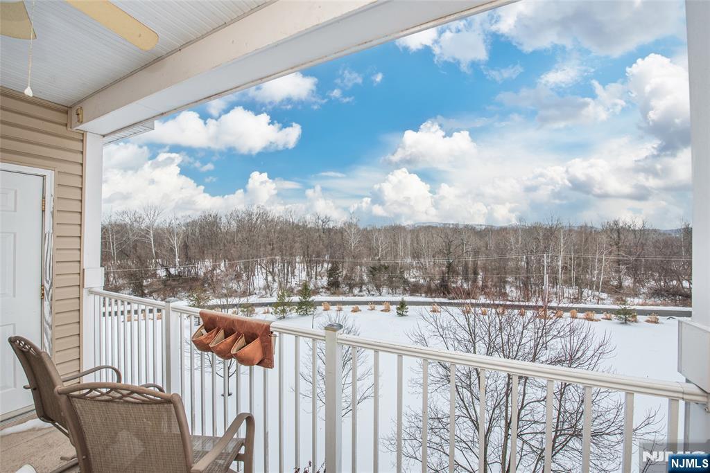 10323 Warrens Way Wanaque, NJ 07465 - Photo 22 of 30 a view of a balcony with wooden fence