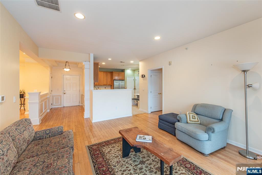 10323 Warrens Way Wanaque, NJ 07465 - Photo 3 of 30 a living room with furniture and view of kitchen