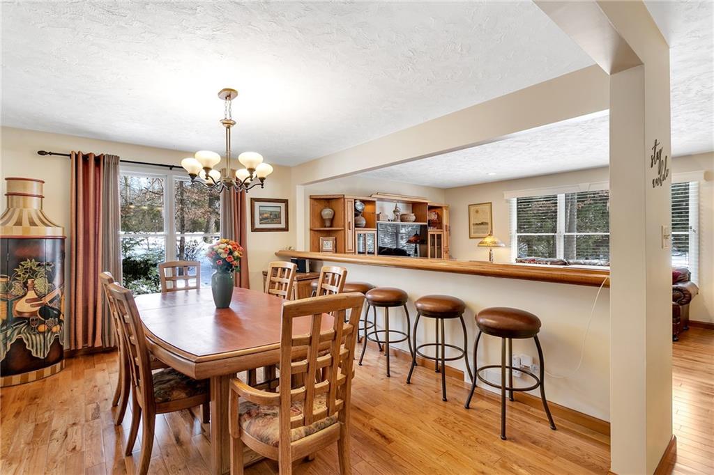 404 Golden Grove Road Baden, PA 15005 - Photo 8 of 25 a view of a dining room with furniture window and wooden floor
