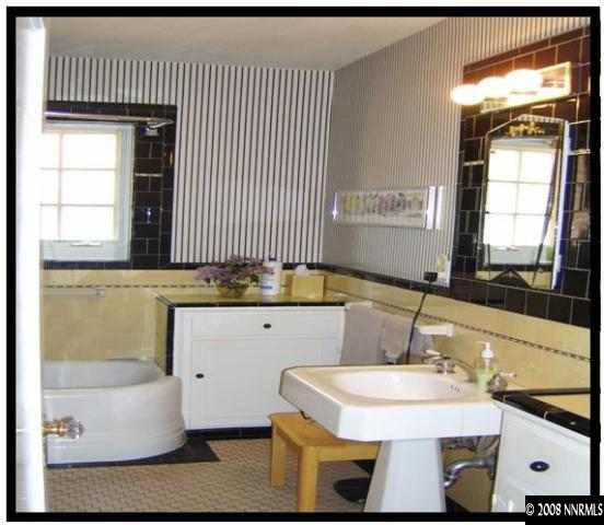 665 Manor Drive Reno, NV 89509 - Photo 4 of 9 a bathroom with a sink and a mirror
