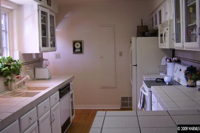 665 Manor Drive Reno, NV 89509 - Photo 6 of 9 a kitchen with a sink and cabinets