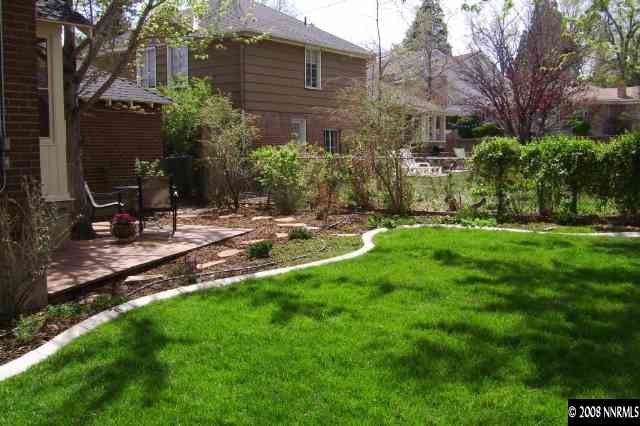 665 Manor Drive Reno, NV 89509 - Photo 7 of 9 a view of backyard with table and chairs and potted plants