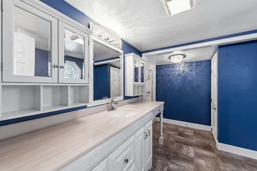 118 Jordan Road Blairsville, GA 30512 - Photo 24 of 49 a bathroom with a sink and a mirror