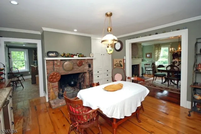 a kitchen with granite countertop white cabinets white stainless steel appliances a sink and a window