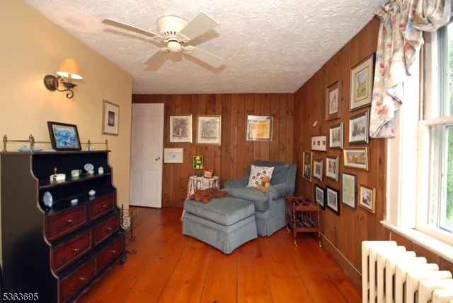 a workspace with wooden floor and furniture