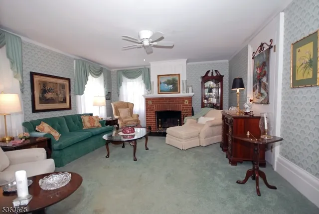 a living room with furniture a window and a fireplace