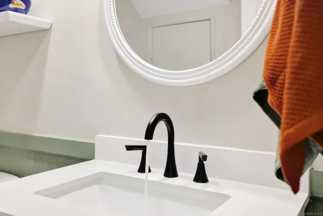 a close view of a sink and a window