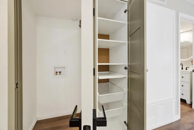 a view of closet area with empty racks