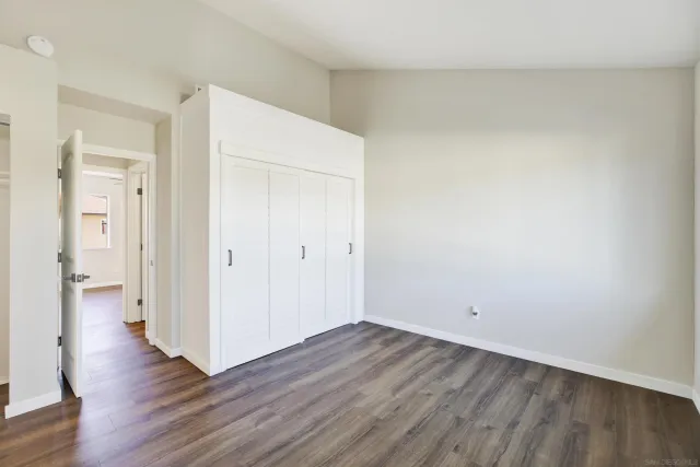 a bathroom with double vanity and a mirror