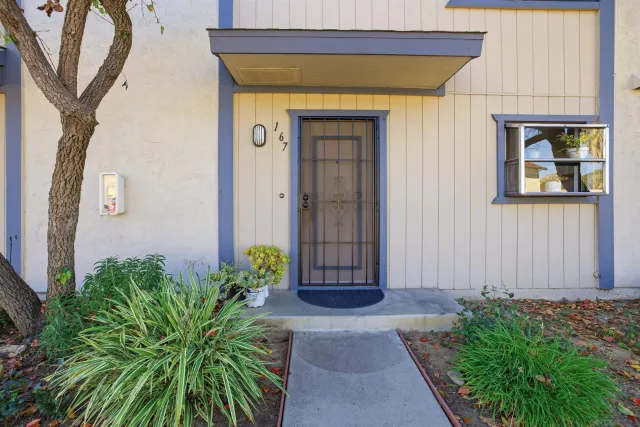 a front view of a house with garden