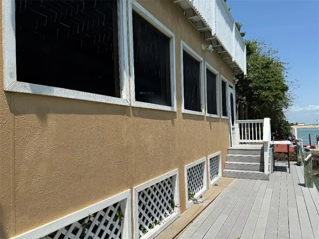 a view of a balcony with furniture