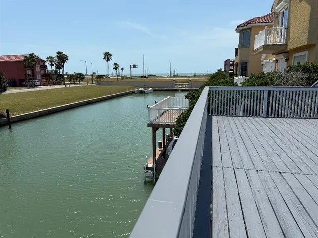a view of a chairs and table in a backyard