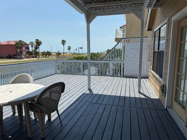 a view of balcony with furniture
