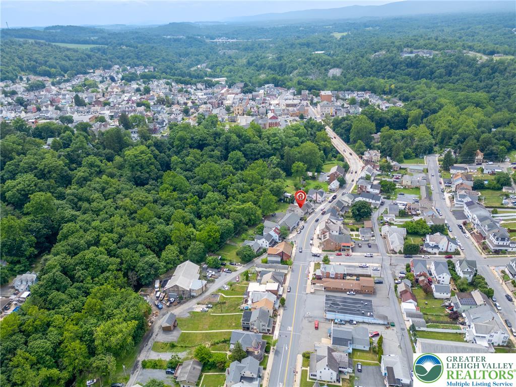 313 Main Street Slatington, PA 18080 - Photo 72 of 73 An aerial perspective reveals a vibrant community nestled among lush, tree-covered hillsides.