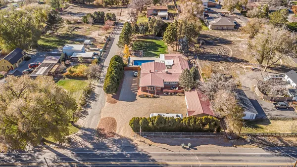 an aerial view of a house with a yard