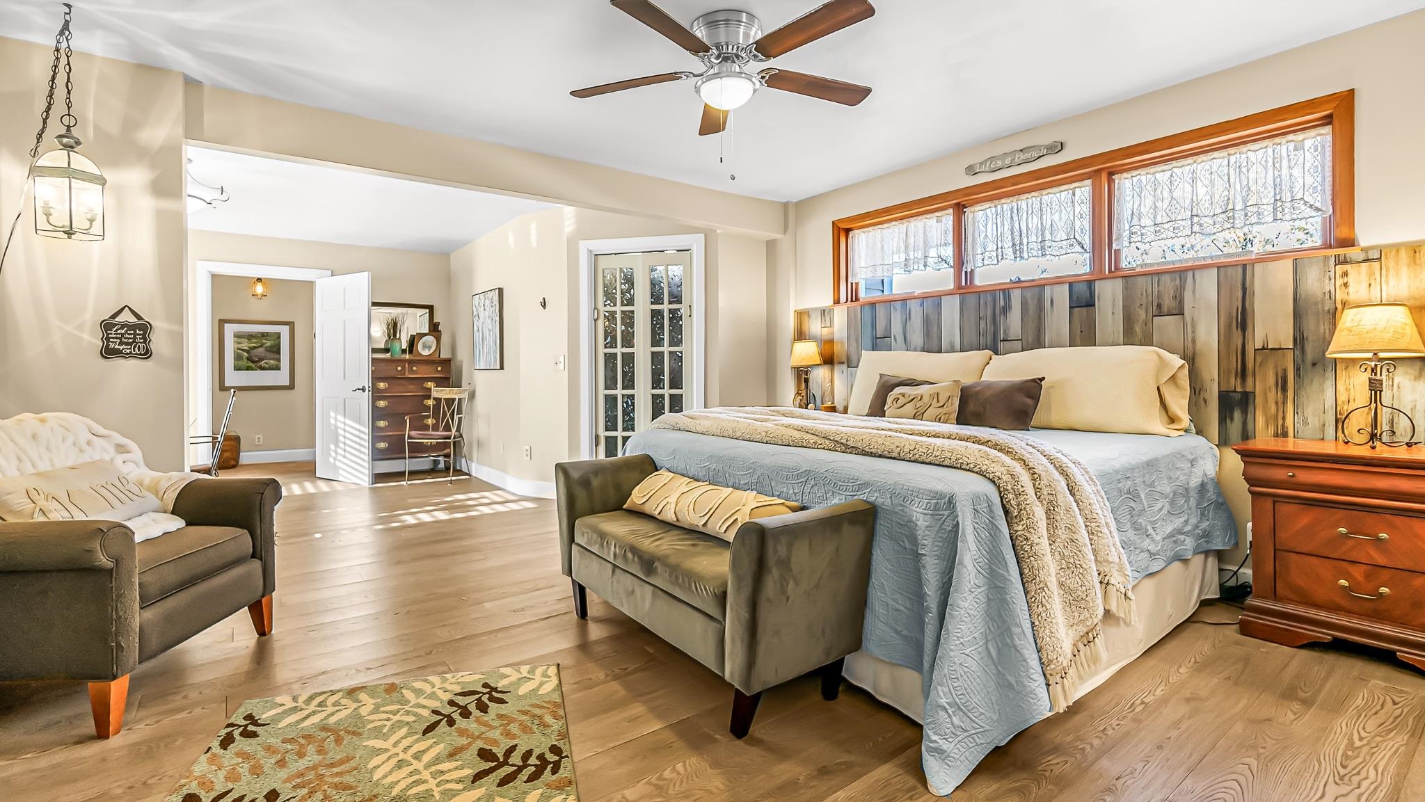 623 26 Road Grand Junction, CO 81505 - Photo 22 of 42 a spacious bedroom with a bed couch and windows