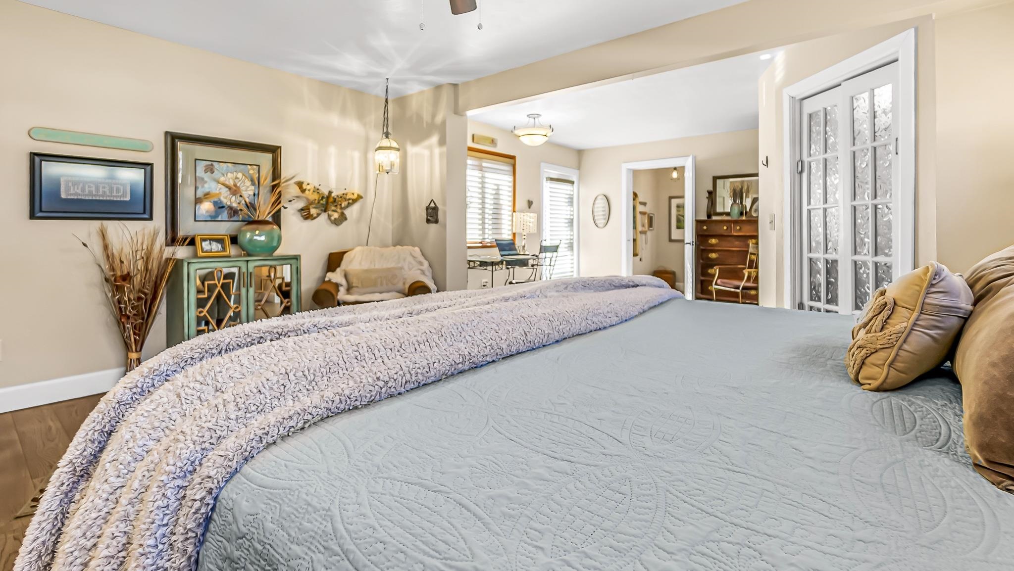 623 26 Road Grand Junction, CO 81505 - Photo 23 of 42 a spacious bedroom with a bed and wooden floor