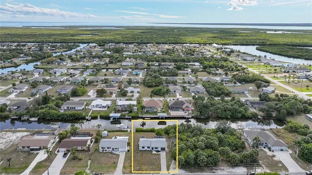 an aerial view of residential building and lake