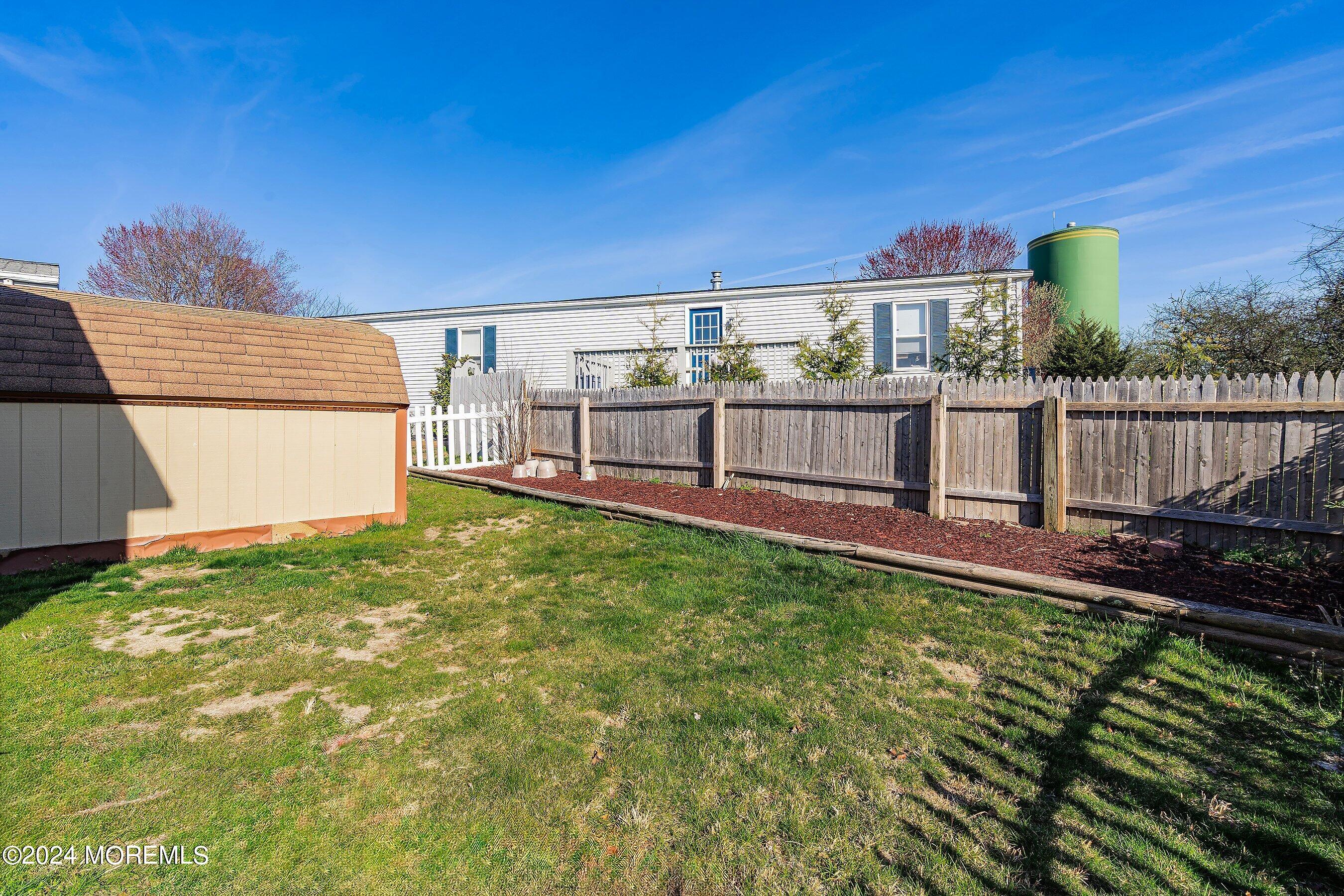 11 Ruffian Way Howell, NJ 07731 - Photo 16 of 17 a view of a backyard with sitting area