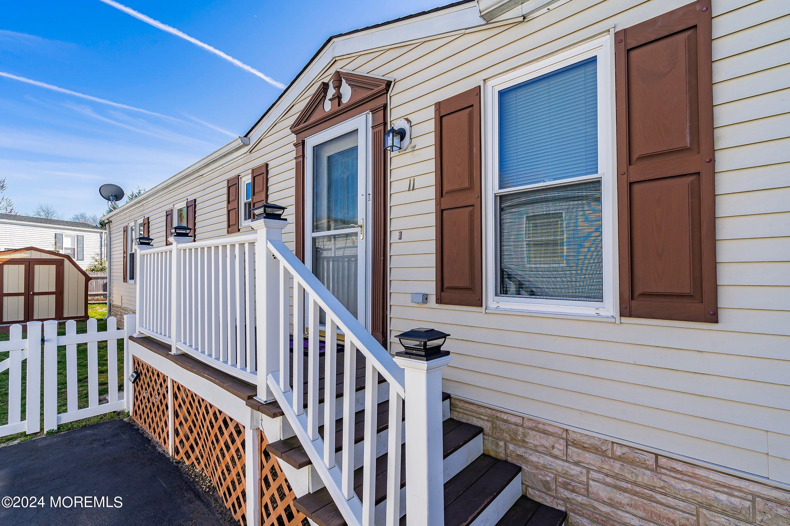 11 Ruffian Way Howell, NJ 07731 - Photo 2 of 17 a view of deck and wooden floor