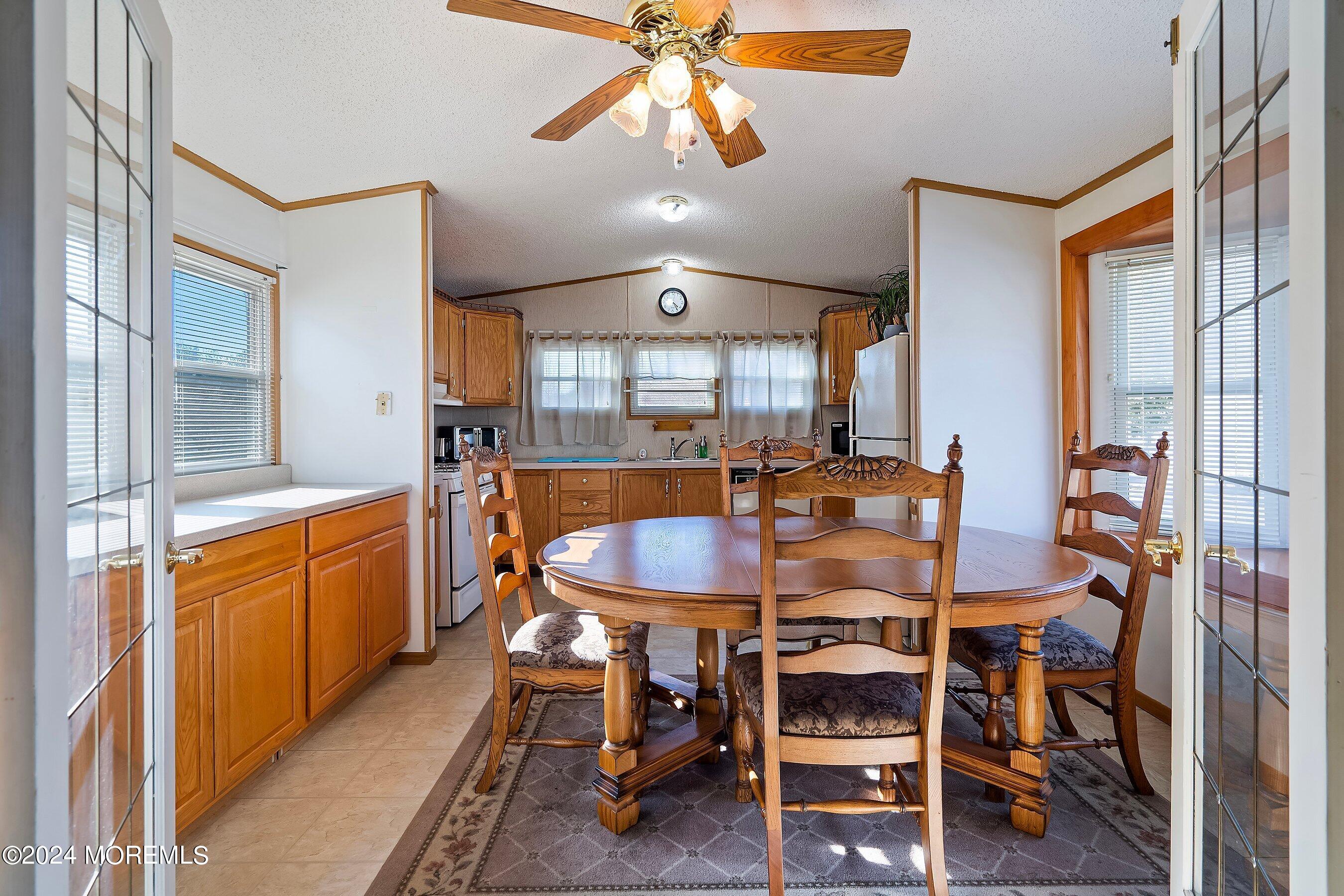 11 Ruffian Way Howell, NJ 07731 - Photo 6 of 17 a dining room with furniture a chandelier and window