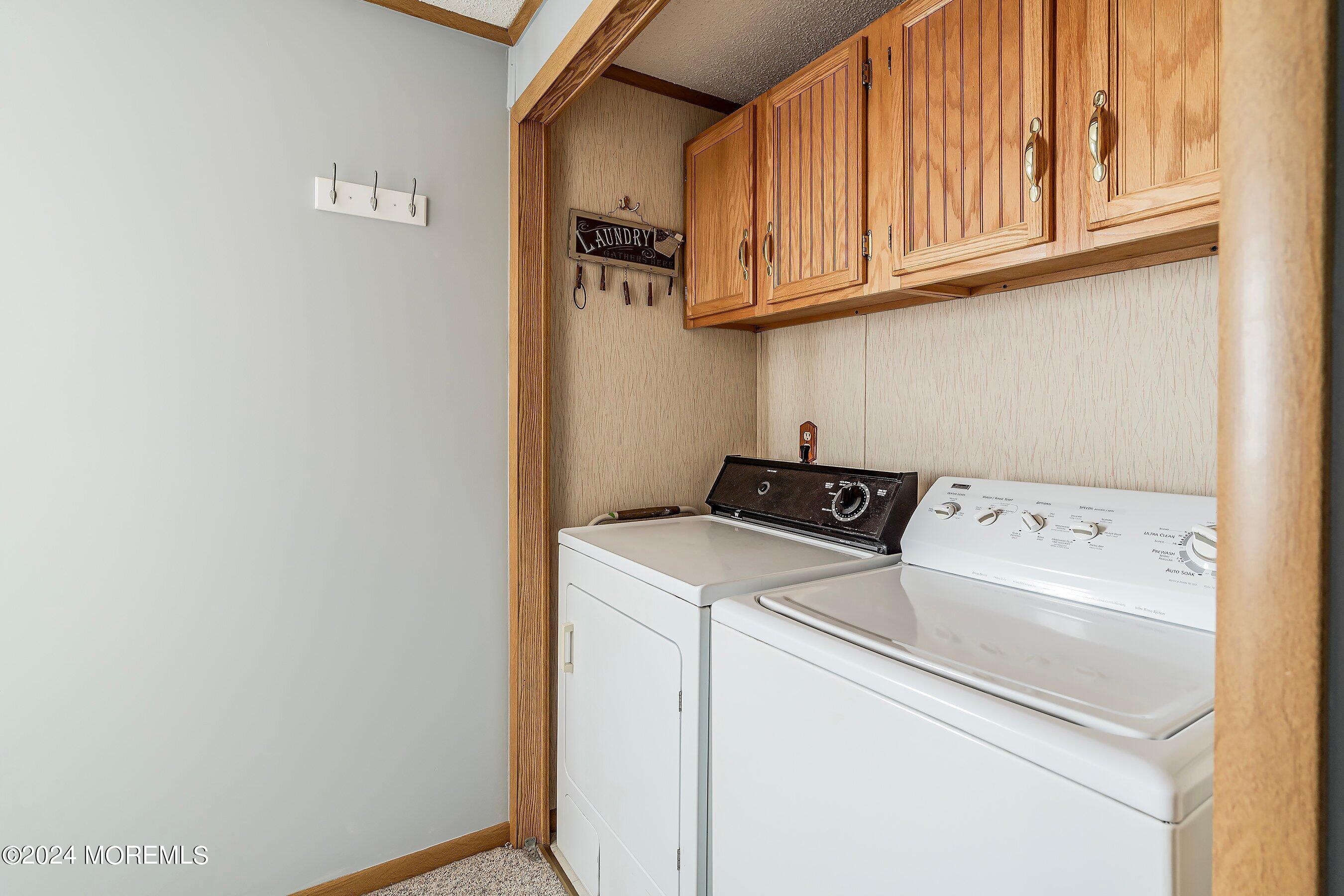 11 Ruffian Way Howell, NJ 07731 - Photo 10 of 17 a utility room with dryer and washer