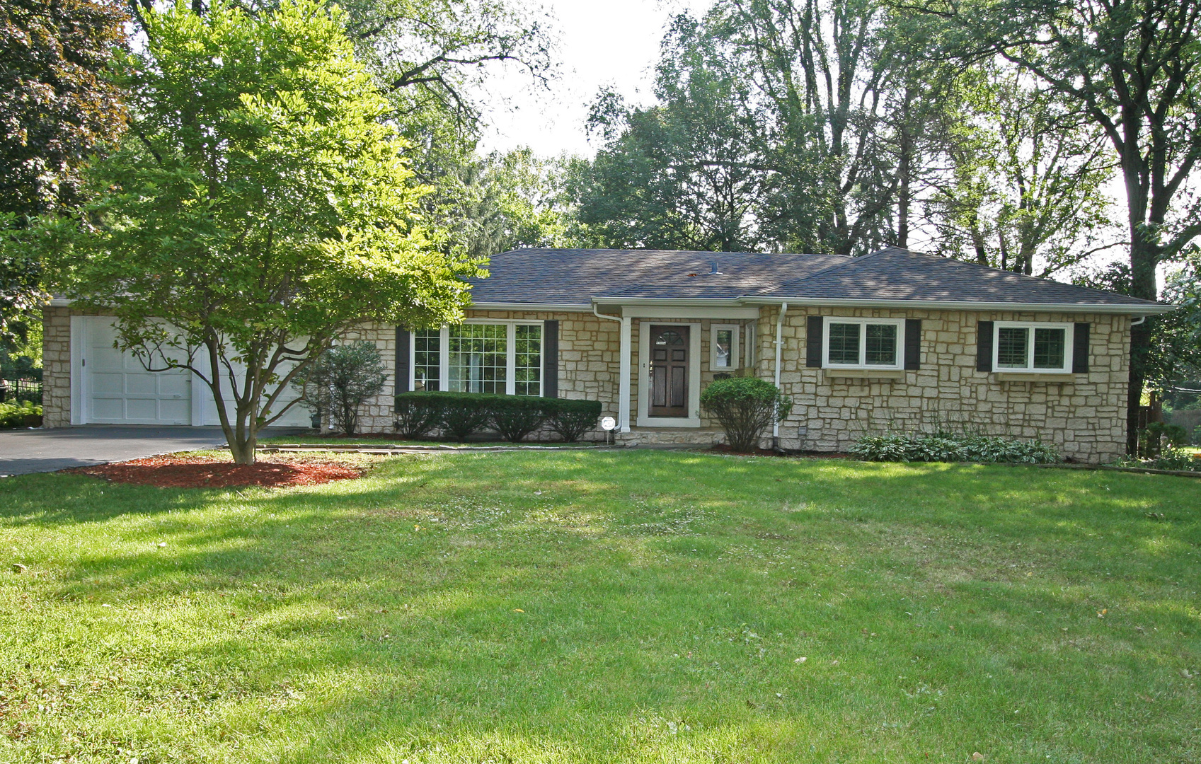 1125 Woodview Road Burr Ridge, IL 60527 - Photo 1 of 22 a view of a house with a backyard