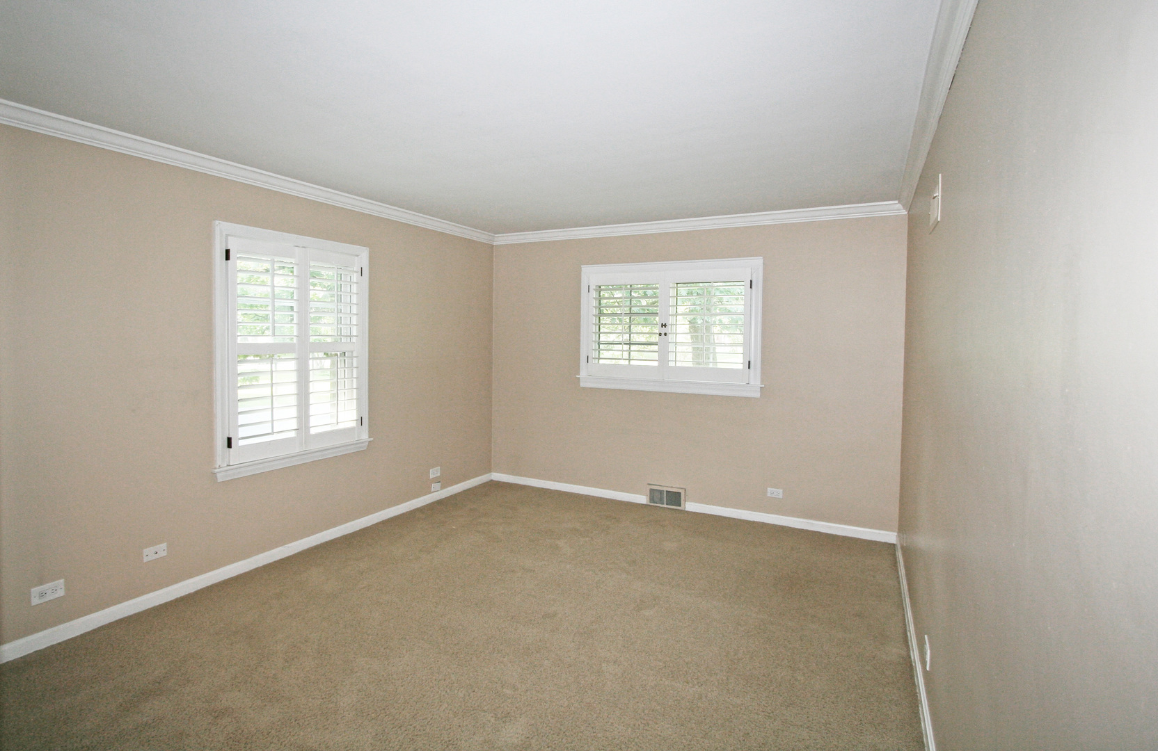 1125 Woodview Road Burr Ridge, IL 60527 - Photo 11 of 22 an empty room with windows