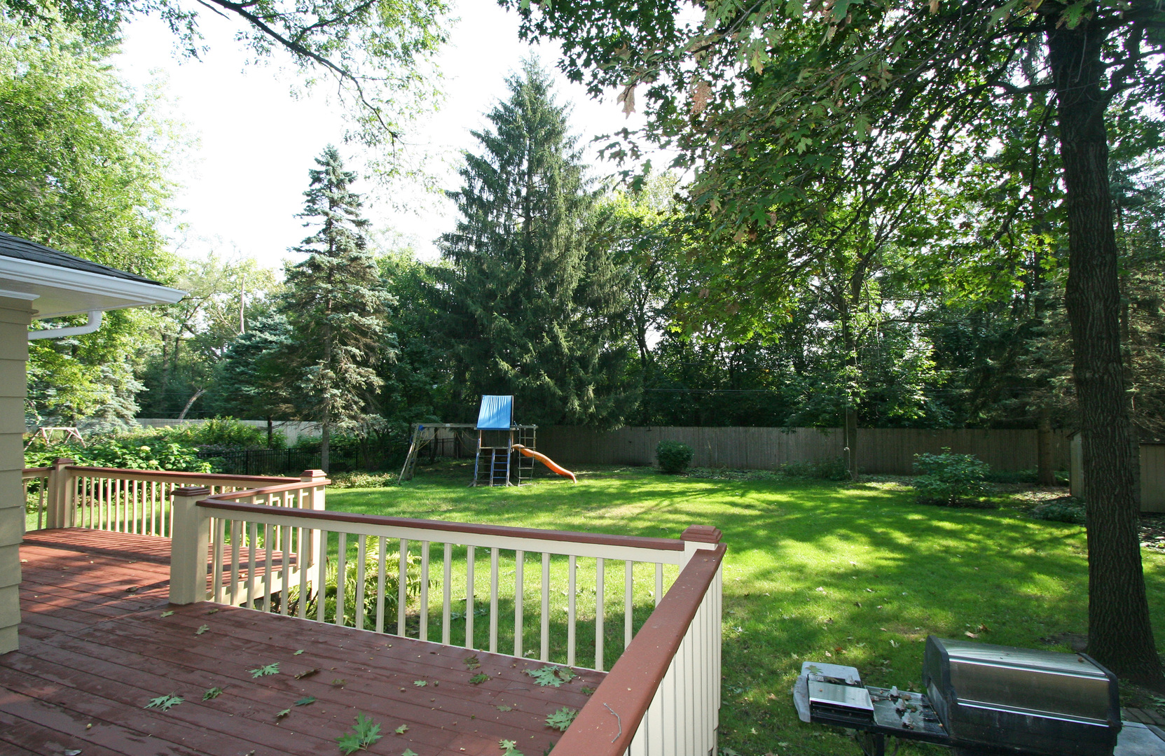 1125 Woodview Road Burr Ridge, IL 60527 - Photo 21 of 22 a view of deck with furniture and garden