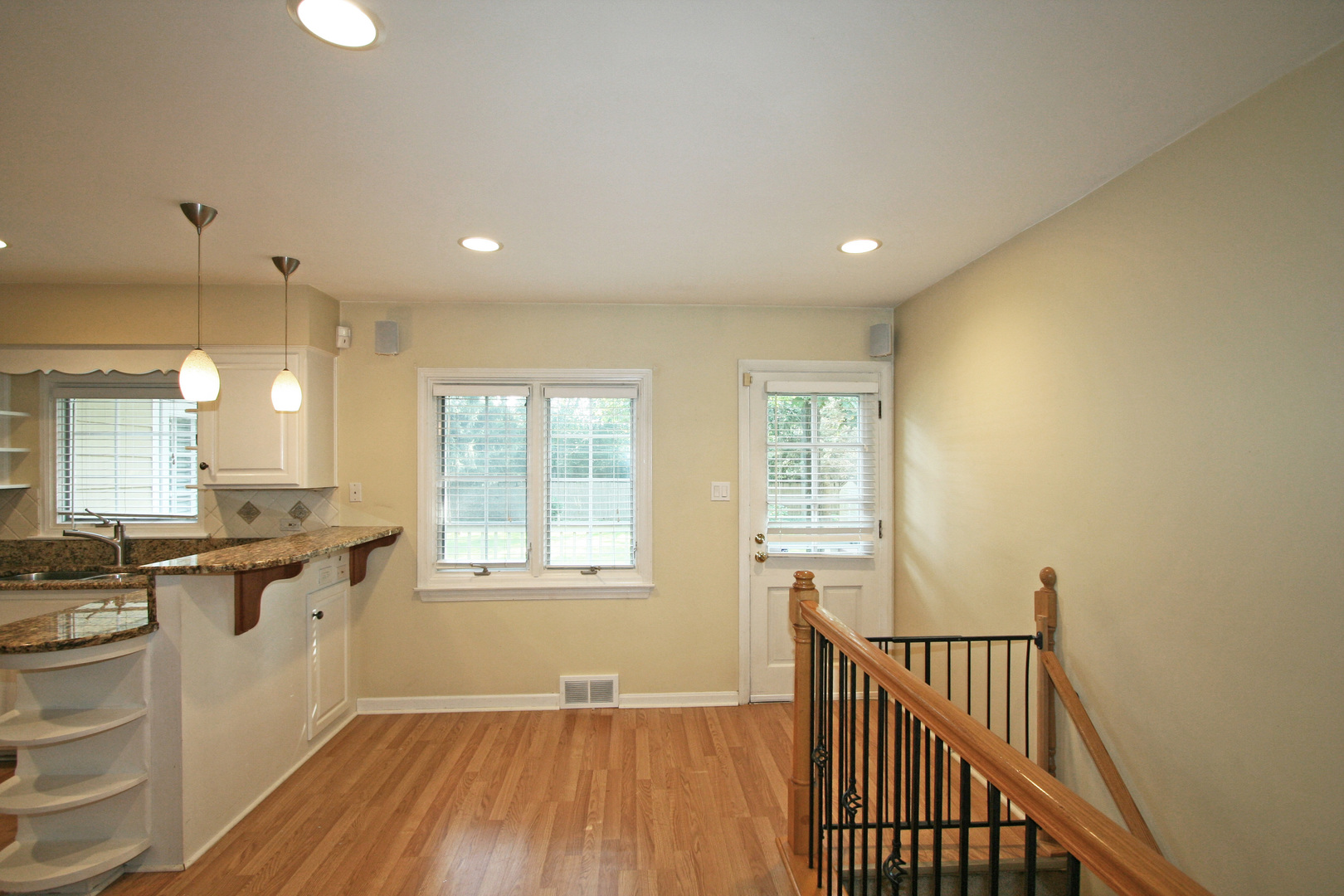 1125 Woodview Road Burr Ridge, IL 60527 - Photo 9 of 22 a view of a kitchen counter space with wooden floor and electronic appliances