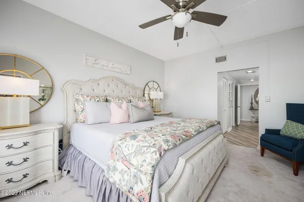 a bedroom with a bed and a dresser