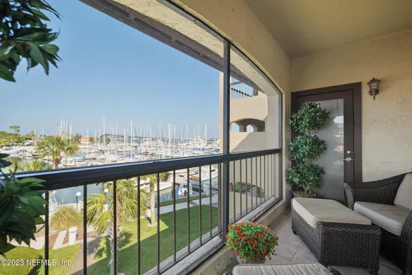 a view of a balcony with furniture