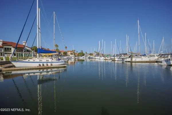 a view of a lake with boats and small boats