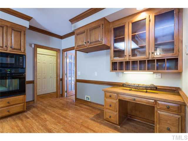 2404 Eddystone Road Raleigh, NC 27612 - Photo 12 of 25 a kitchen with a stove and a microwave