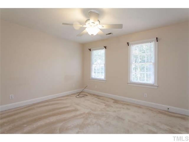 2404 Eddystone Road Raleigh, NC 27612 - Photo 19 of 25 a view of an empty room with a window