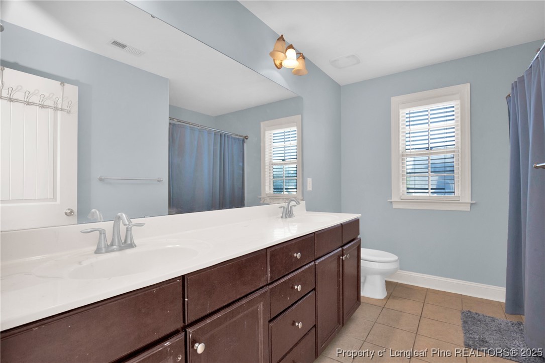 131 Revolutionary Road Cameron, NC 28326 - Photo 24 of 46 a bathroom with a sink double vanity granite and a mirror